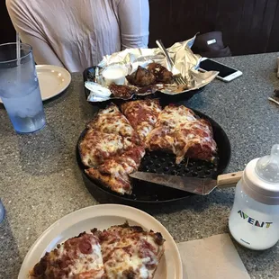 Meat lovers deep dish and honey BBQ wings