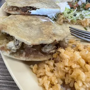 a plate of food with rice and a fork