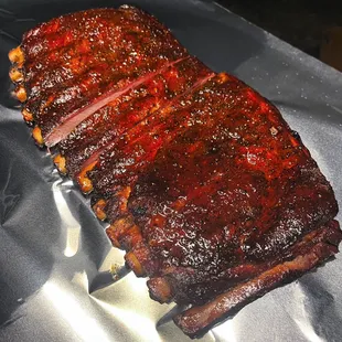 a rack of ribs on a piece of tin foil