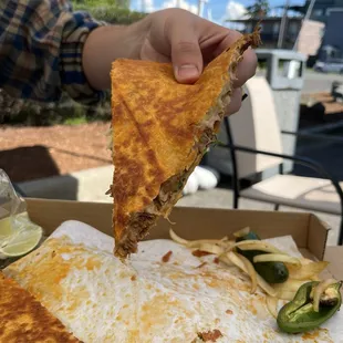 Birria Pizza  consomé, limes, salsas and jalapeños included