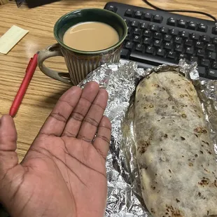 Saucy New York Chic.. this picture is deceiving this burrito is definitely bigger than my hand