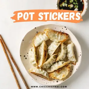 a plate of dumplings and chopsticks