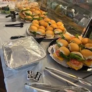 a buffet of sandwiches and salads