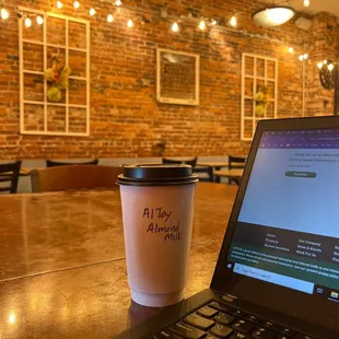 a cup of coffee and a laptop