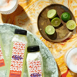 three bottles of sour sour on a table