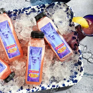 three bottles of chichacha on ice