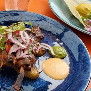 One lamb and one beef skewer.