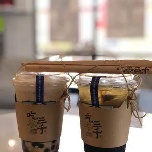 Boba Milk tea (left) and honey green tea with grass jelly (right)