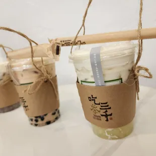 Left to Right: Dong Ding Oolong Tea with Taro Balls and Mousse Bubble Milk Tea Osmanthus Oolong Tea with Coconut Jelly and Cream