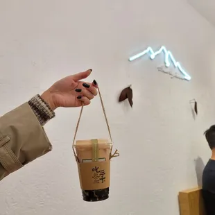 a person holding a cup of coffee
