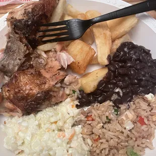 Chicken, yucca, beans, coleslaw, rice
