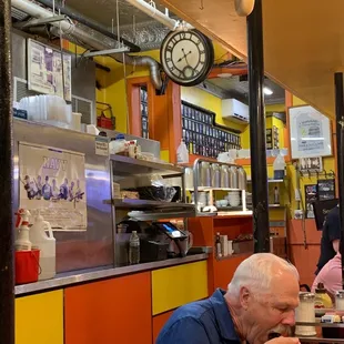 a man eating at a restaurant