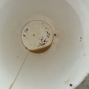 Coffee grinds mixed with black plastic pieces! Yum