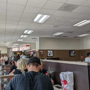 ows people sitting at tables in a restaurant