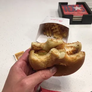 Are half the sandwich and finally got a bite of chicken.