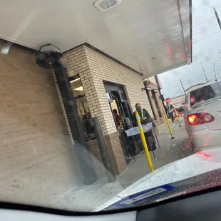 ows a view of a gas station from inside a car