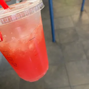 ows a drink in a plastic cup