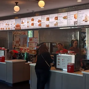 ows people ordering at a fast food restaurant