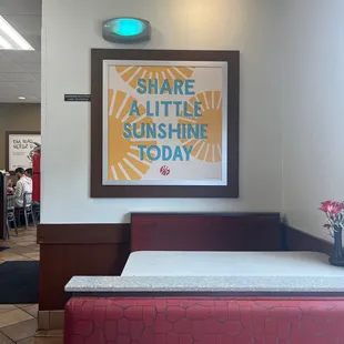 ows a picture of a restaurant with a sign that says share a little sunshine today