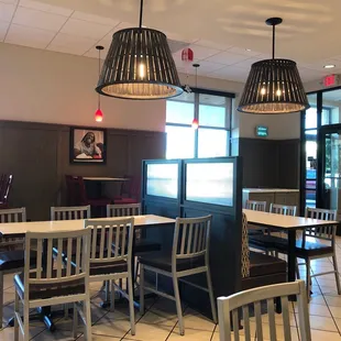 Photo of black man eating fried chicken on the wall of dining room.  WOW.