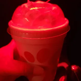 Peach milkshake, highly recommend!!! Sorry for the red lighting. I was going thru the car wash when I snapped the pic.