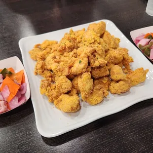 The owner gave us some delicious Korean pickles  The sour and sweet complimenting the chicken makes it so much more refreshing!