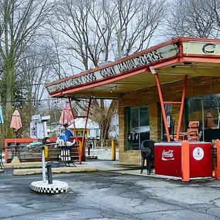 a woman sitting at a gas station