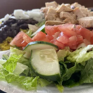 Chicken, rice, beans, and a side salad