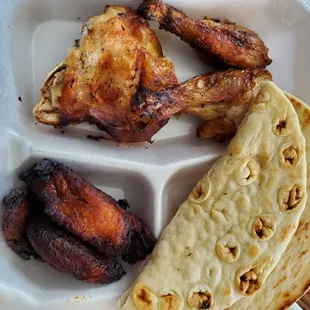 Quarter dark chicken with sweet plantains and a warm pita