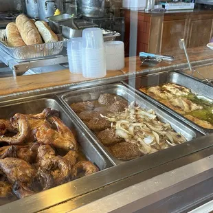 Display of chicken, beef patties, and fish