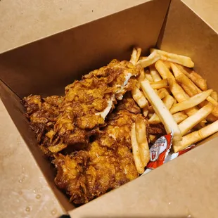 Chicken strips (with a bite taken cuz she couldn&apos;t wait lol)