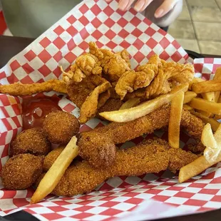 Fish and shrimp with fries as side.