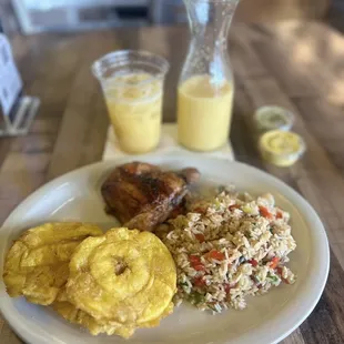 1/4 Dark Meat with Veggie Rice and Tostones. Fresh Mango Natural Juice