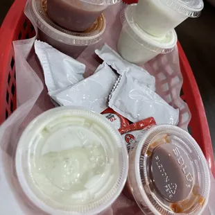 Sauces (spicy &amp; tzatziki) and ketchup.