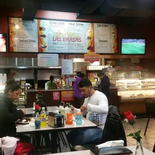 people sitting at tables in a restaurant