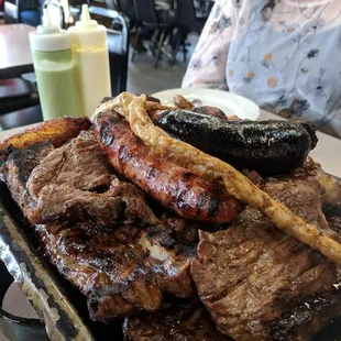Argentine Grill for about $56. Enough food for at least 4 hungry people.  Comes with all that meat plus side of rice, fries, yucca and salad