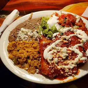 Chicken and cheese enchiladas with the red sauce. Beans and rice.