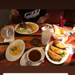 Horchata, ground beef birria with consommé, steak and Mexican rice