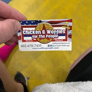 a person holding a sticker