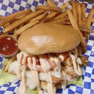 Crispy chicken sandwich with Cajun remoulade and fries