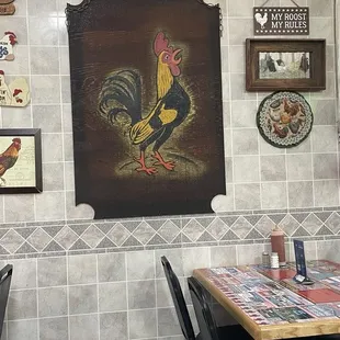 Wall picture of their many chicken decorations