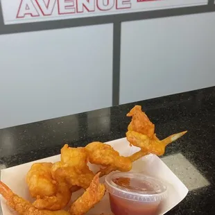 a tray of fried chicken and onion rings