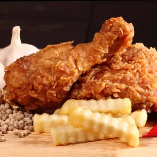 a pile of fried chicken and french fries