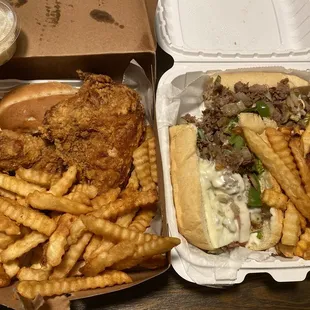 a sandwich and french fries in a styrofoam container