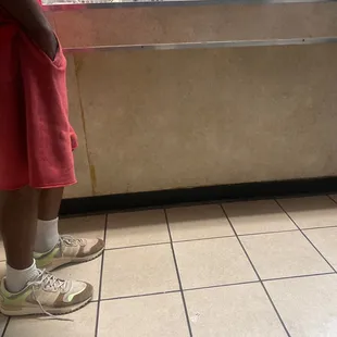 a person standing in front of a counter