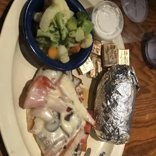 Smothered chicken, baked pot and California veg