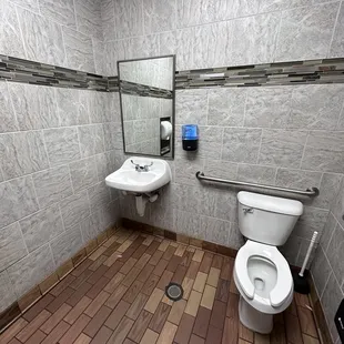 a toilet and sink in a public restroom