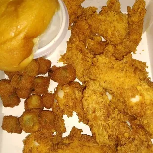 Delicious spicy chicken strip dinner with mashed potatoes and okra with a roll!