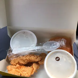 a box of fried chicken and a cup of coffee