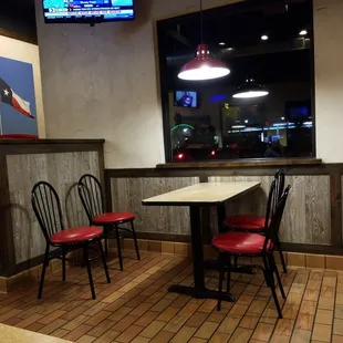 A table, backdropped by the tail end of a very long drive-thru line